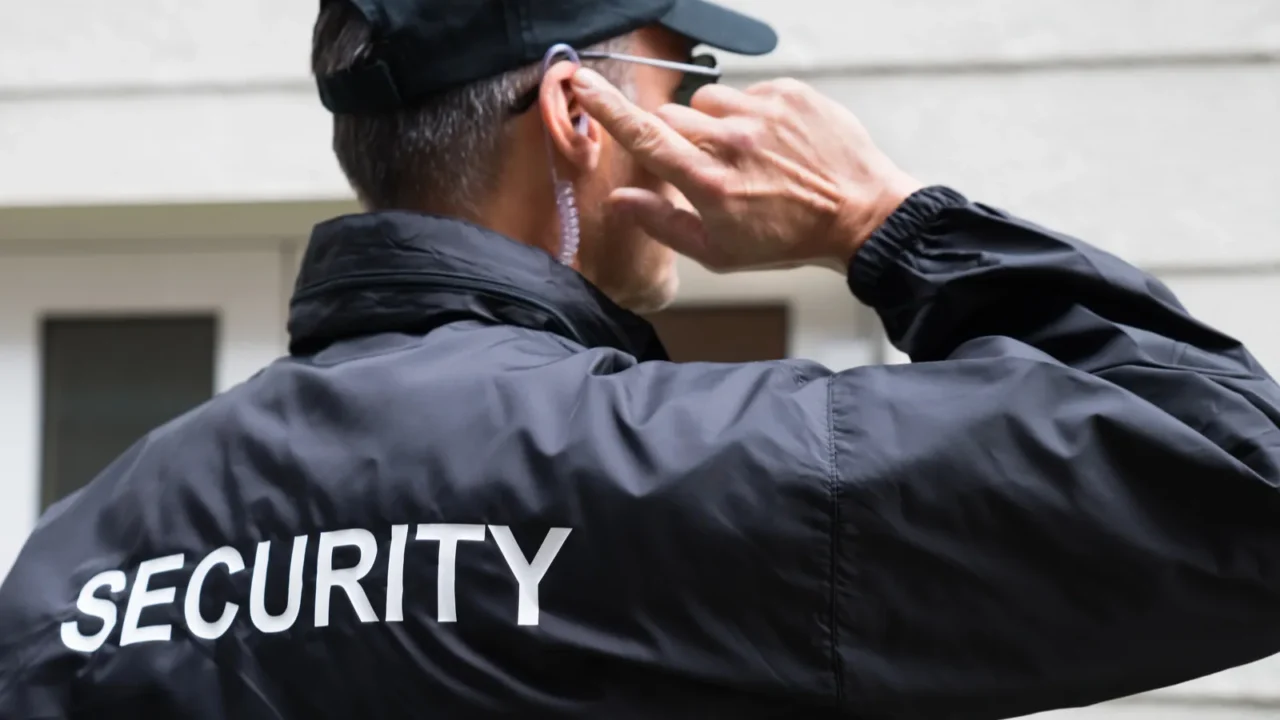 security guard listening to earpiece