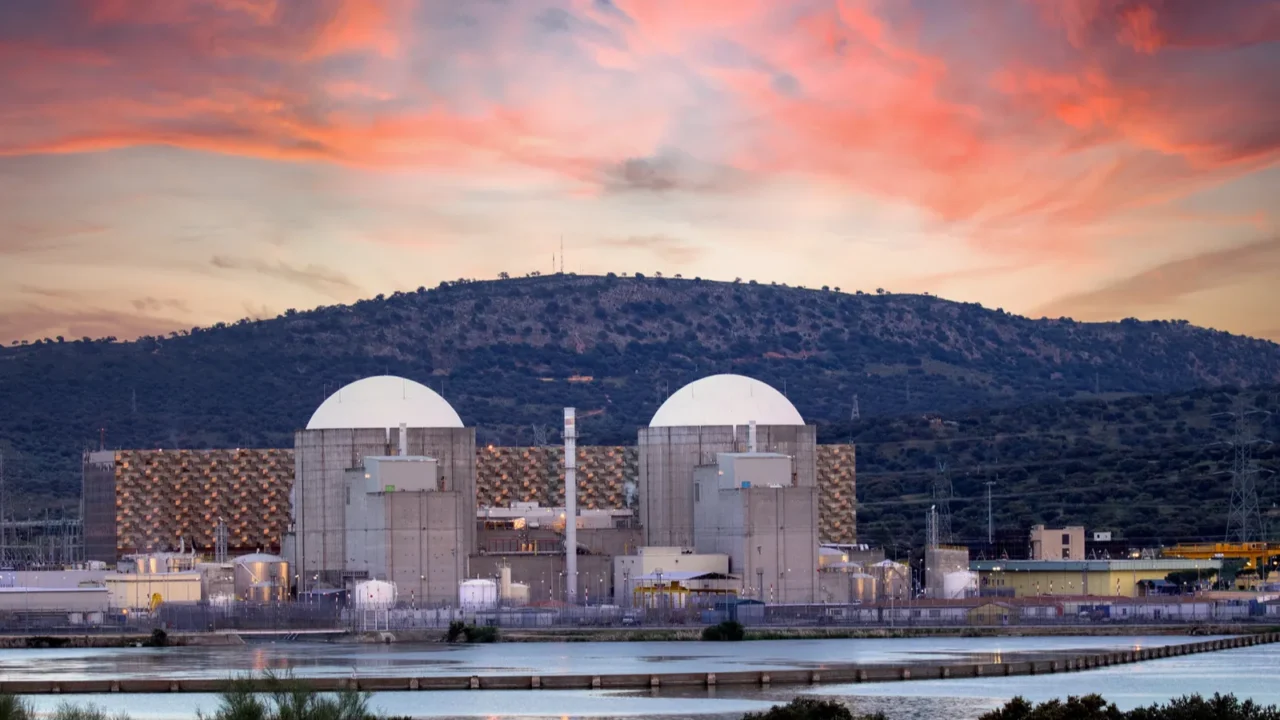 Spanish nuclear power plant next to a river with a stunning sky on the background