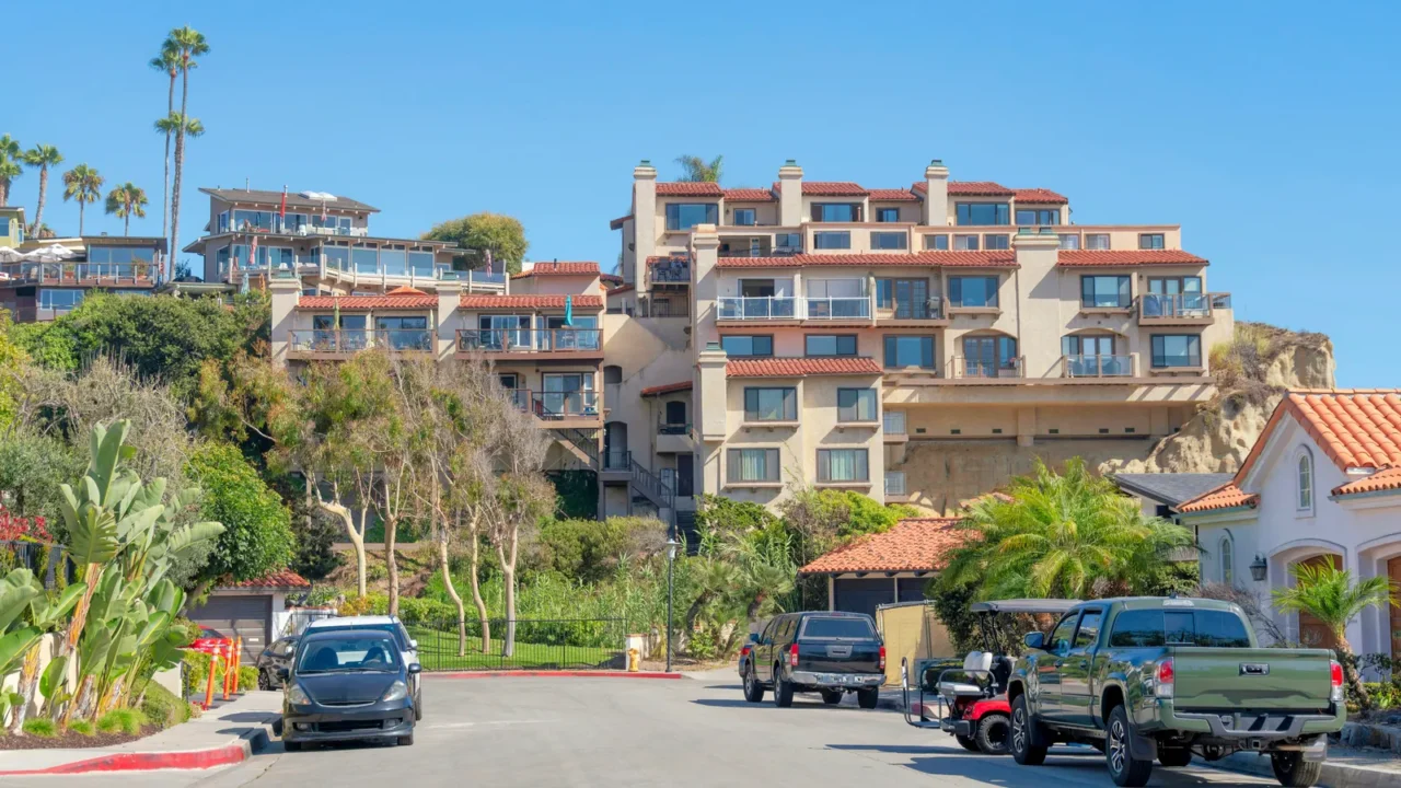 street in a residential area with parked vehicles on the