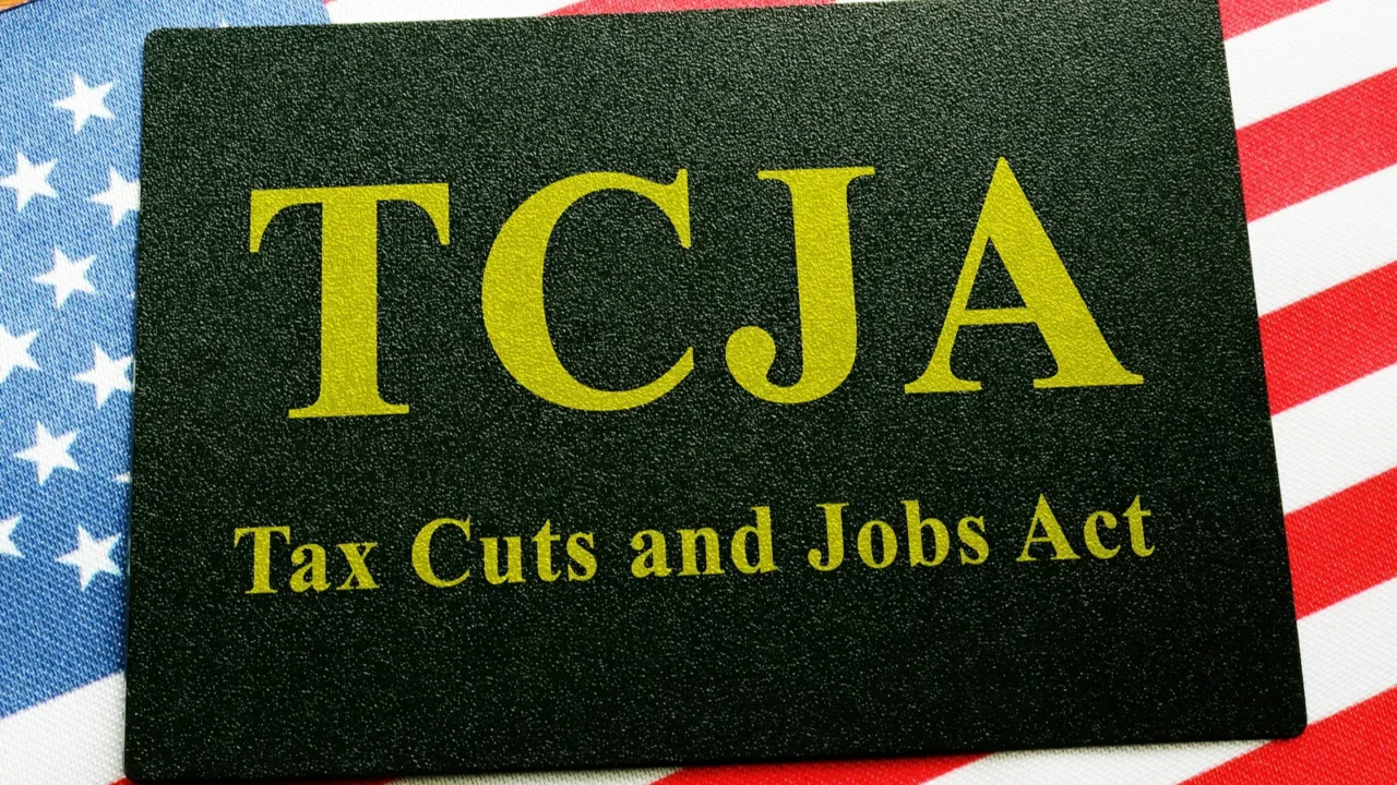 tax cuts and jobs act tcja sign on the flag