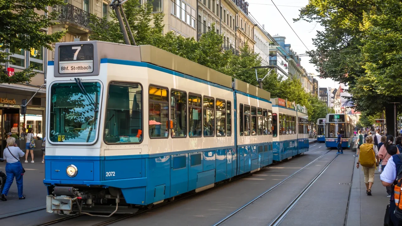 the number 7 tram pulls away from a tram stop