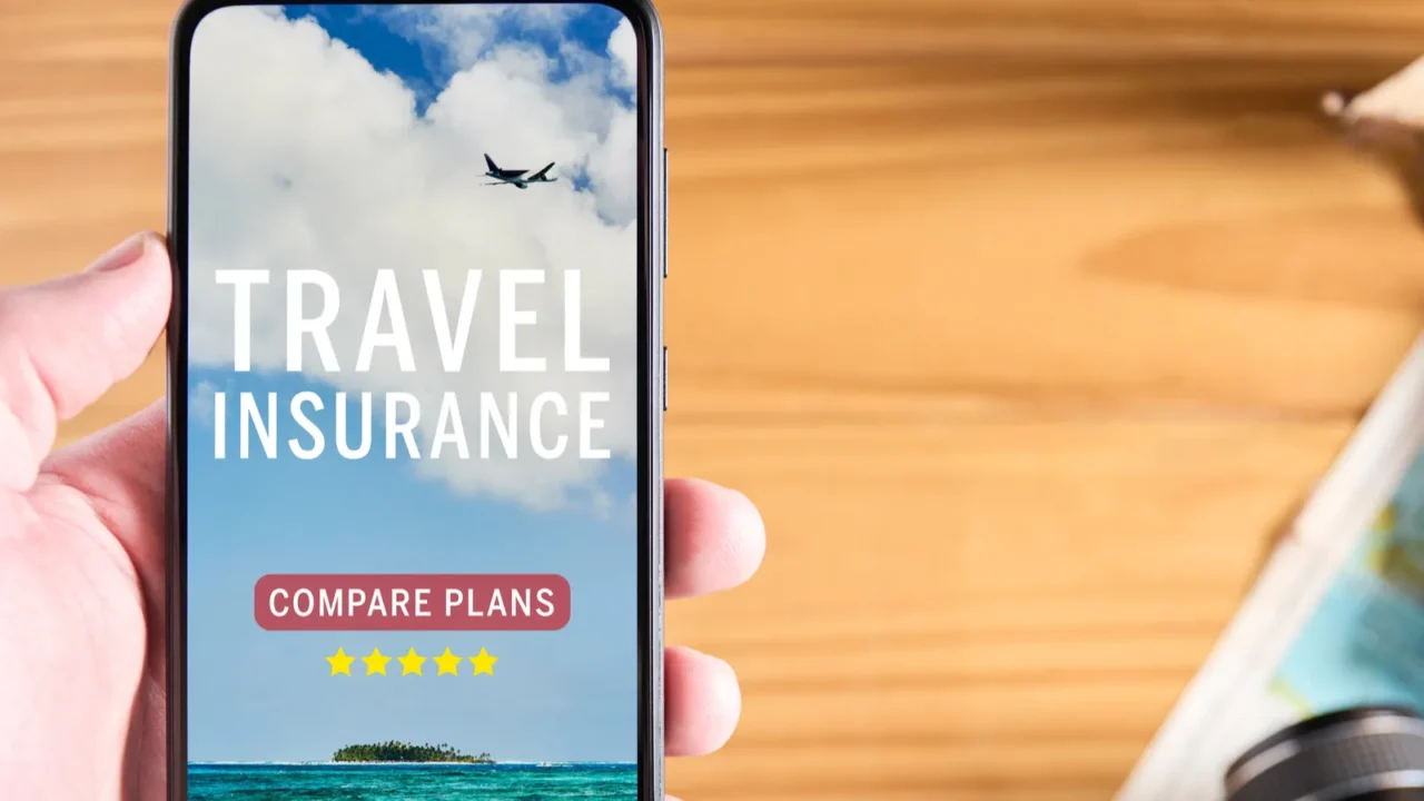 top view of male hand holding mobile phone with travel