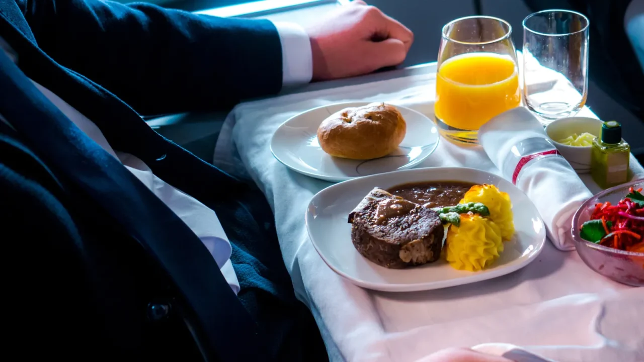 tray with delicious food on the plane business class travel