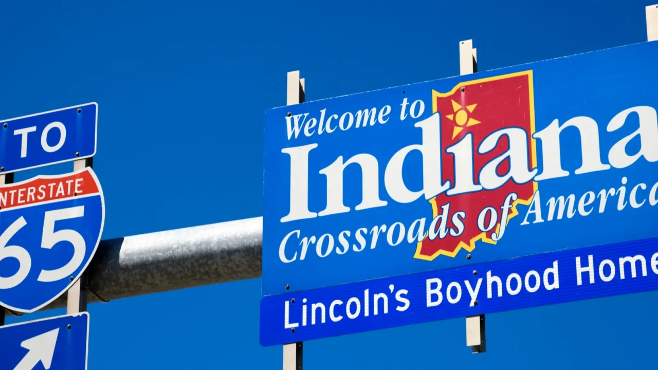 welcome to indiana road sign against blue sky