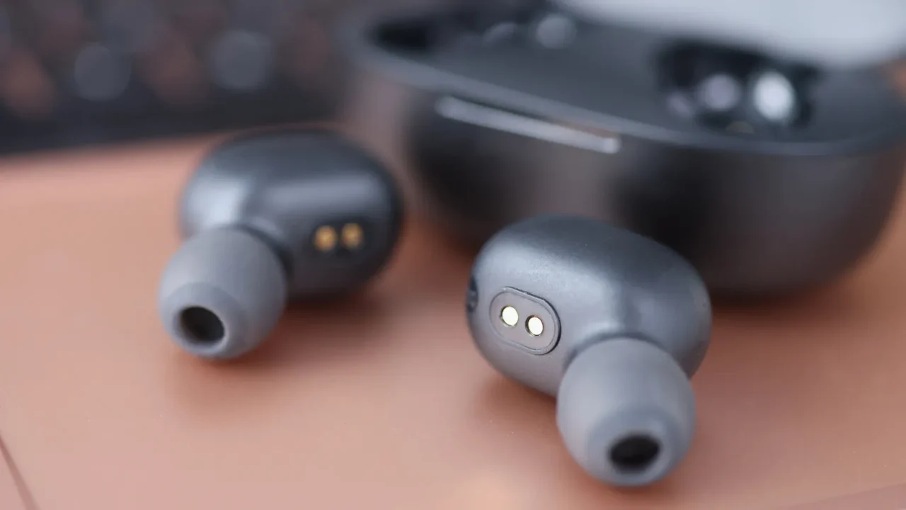 wireless headphones next to the box closeup