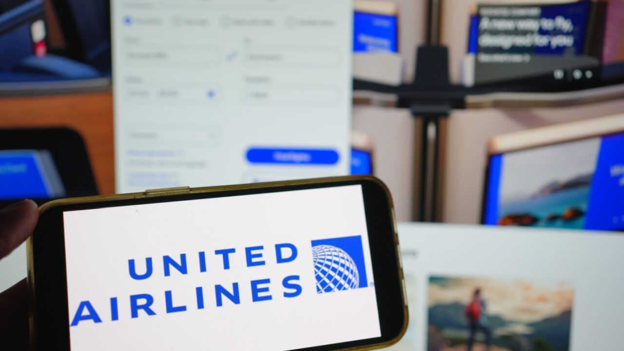 Roosendaal, The Netherlands - August 02, 2025: A mobile phone displaying the company logo of United Airlines, with the company website in the background.