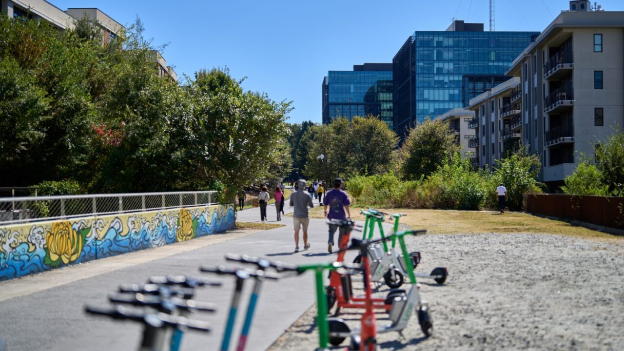 ATLANTA, GEORGIA - OCTOBER 20 2025: Vibrant autumn scene along the Atlanta BeltLine on a sunny October day. People enjoy outdoor activities — walking, jogging, running, and biking.