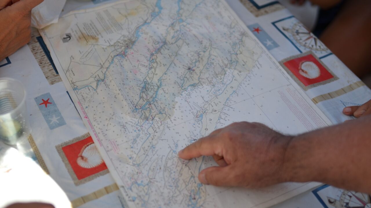 looking map on the sailing boat for the route