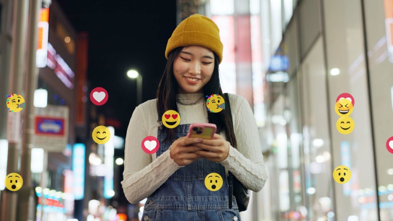 City, emoji and walking with influencer at night for interaction with social media followers. App, phone and reaction overlay with woman outdoor for late sightseeing or travel as content creator