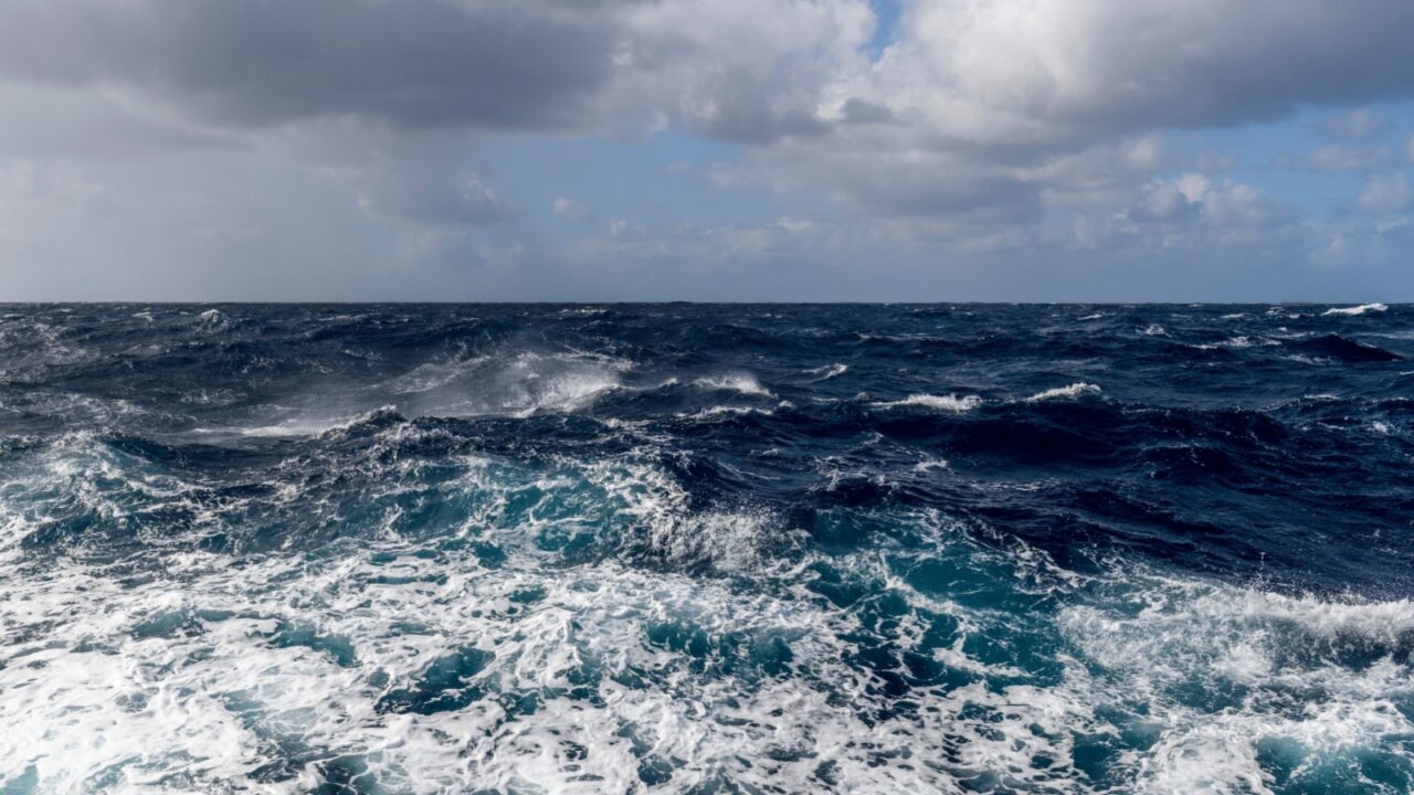 Beautiful seascape - waves and sky with clouds with beautiful lighting. Stormy sea, Bad weather. Gale. Rough sea. Beaufort scale 6.