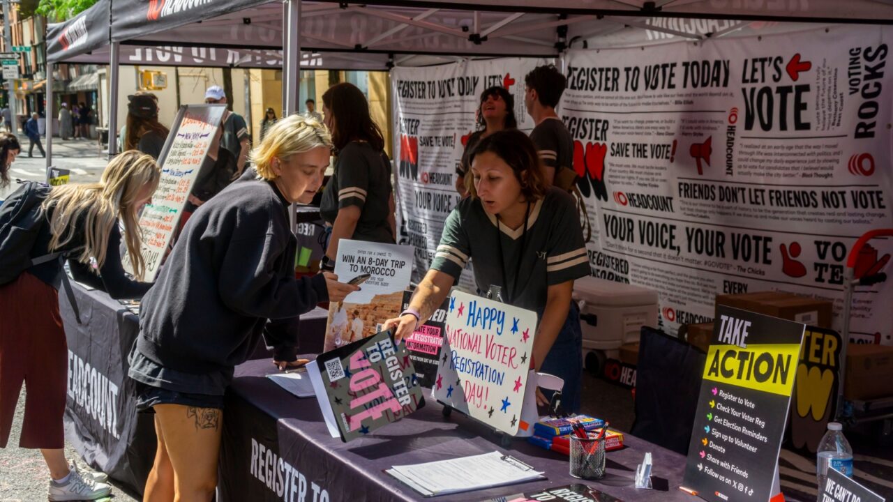 New York NY USA-September 17, 2024 NYU students and other passer-by celebrate National Voter Registration Day byÉ registering to vote, in Greenwich Village outside of New York University