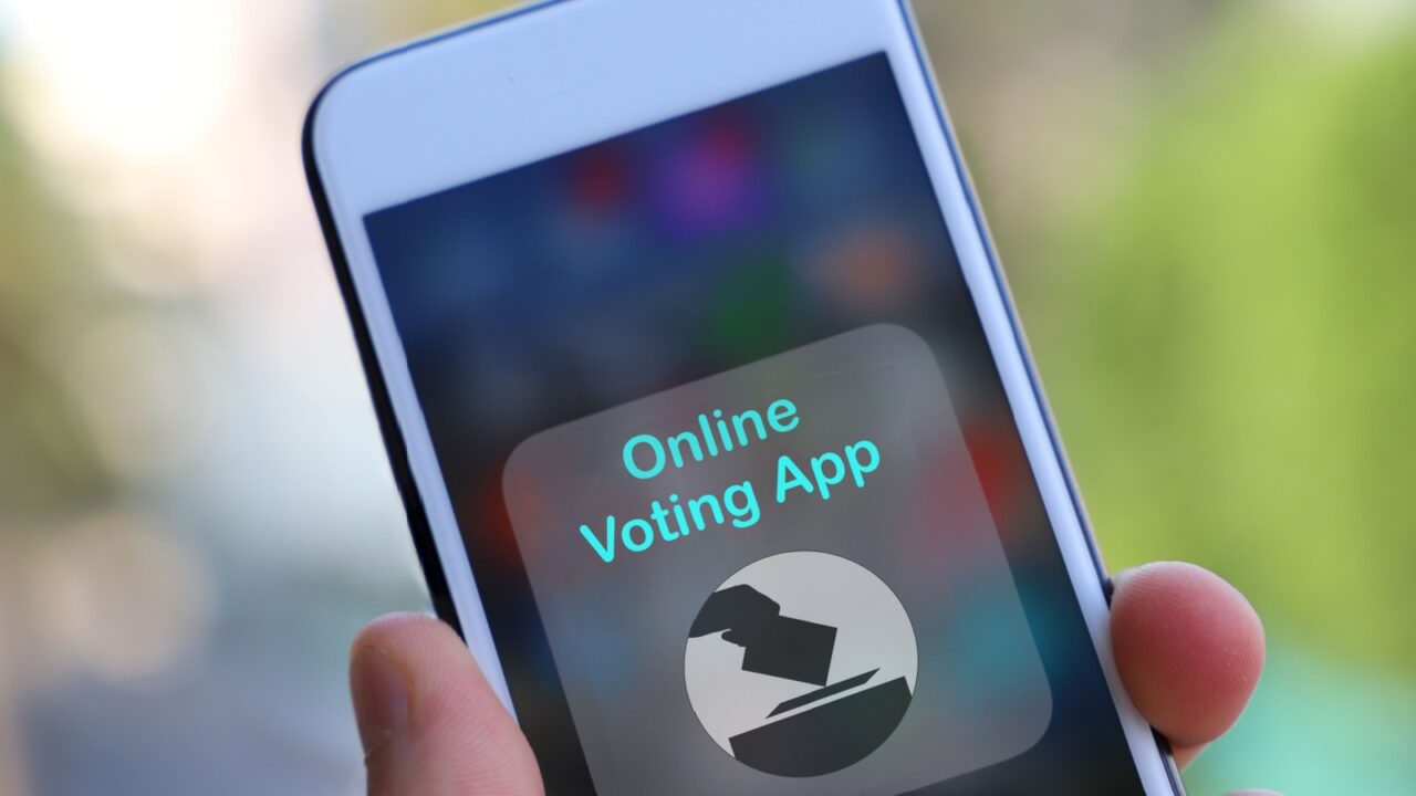 Concept for electronic or internet voting concept (e-voting or online voting). Fake voting app on cellphone. Safe way to vote to maintain social physical distancing during covid pandemic