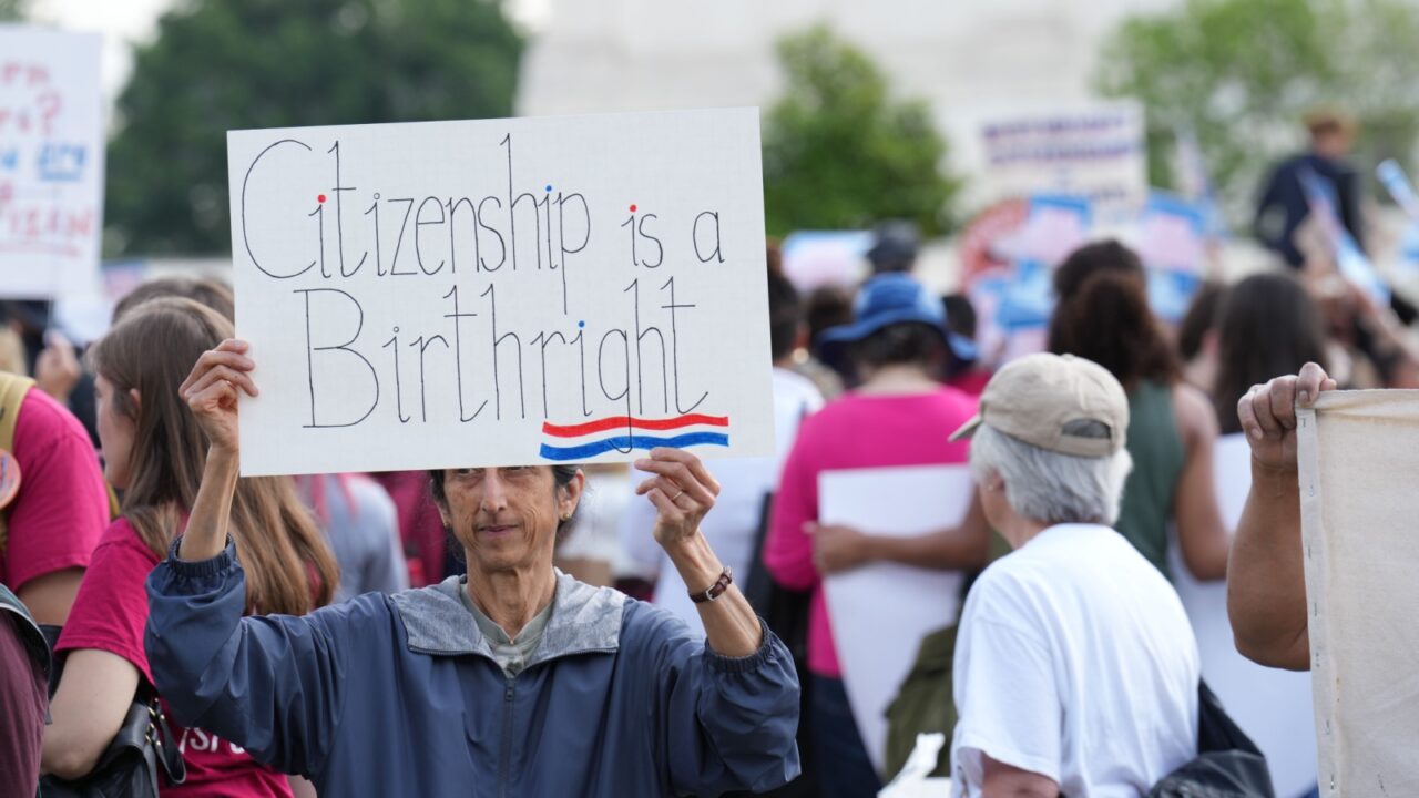 Washington, DC – May 15, 2025: Several hundred protesters rally at the Supreme Court against president Trump's illegal executive order to make birthright citizenship conditional.