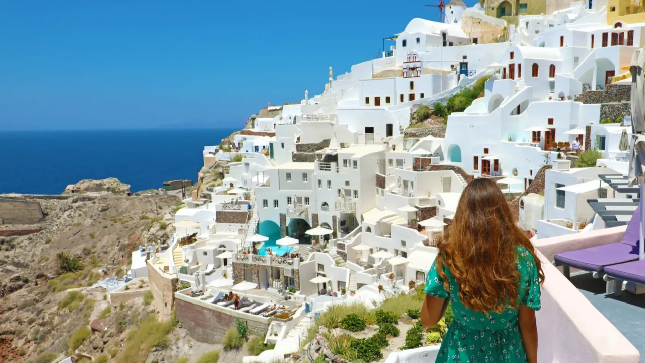 back view of young fashion woman with green dress walking