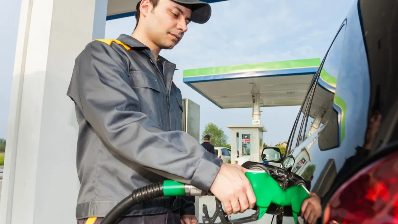 man fueling up a car