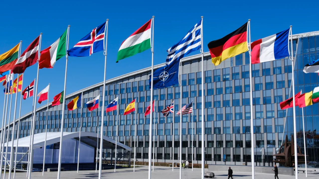 the national flags of countries member of the nato fly