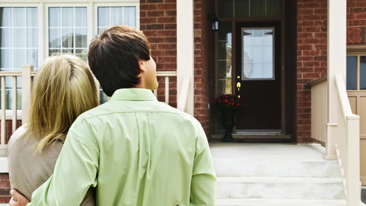 young happy couple shopping for new home